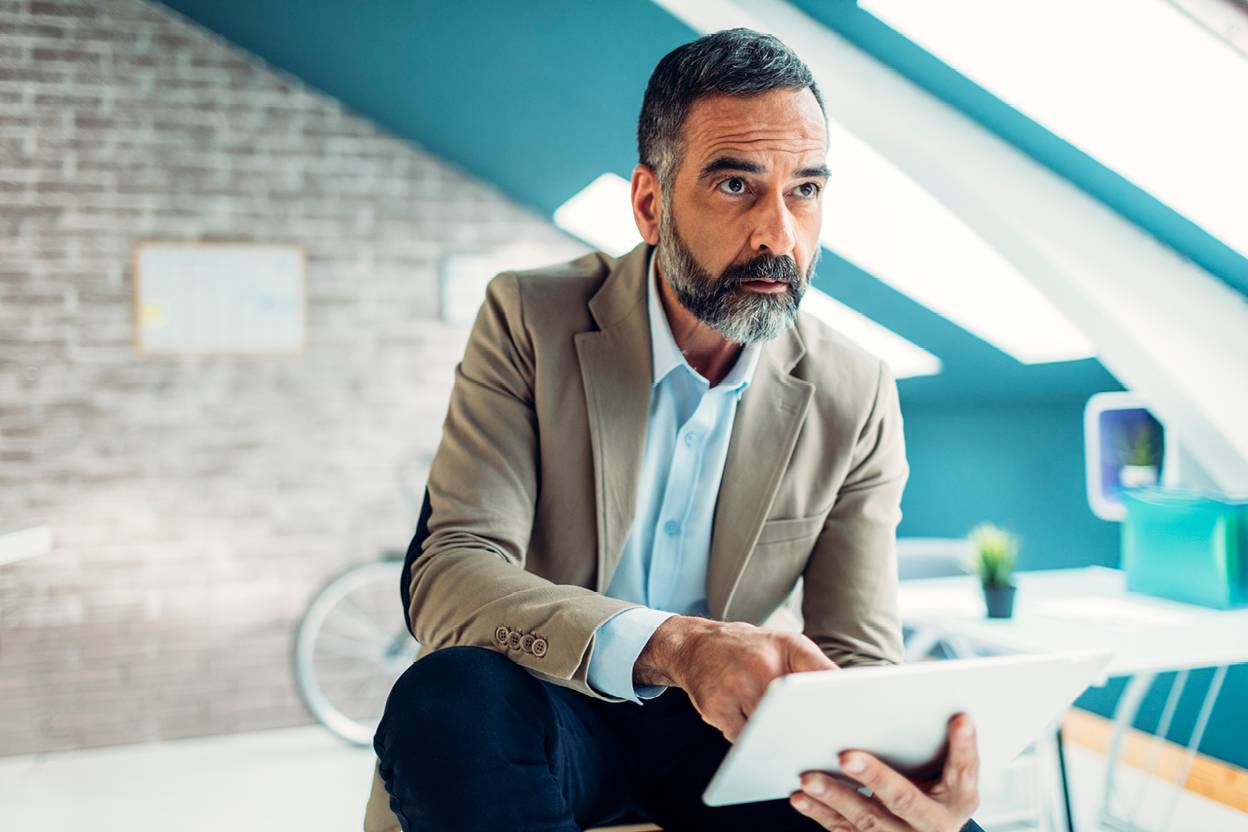 Person sitting on tablet looking into the distance